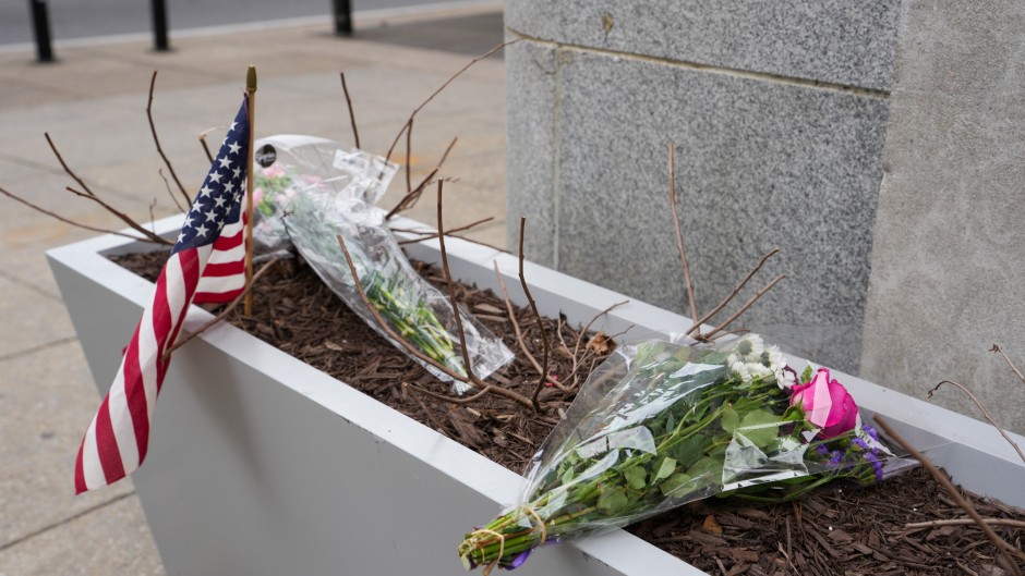 A small memorial of flowers and an American flag has been set up outside the Farragut West Metro station. Andrew Leyden/Getty Images/AFP