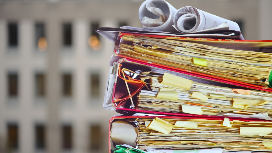 File: A stack of files in an office. GettyImages/thomas-bethge