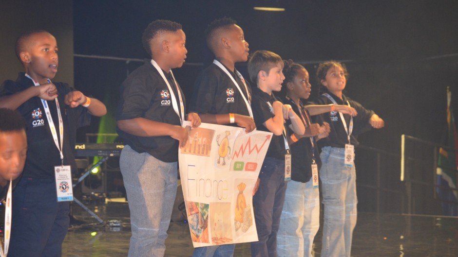 Child delegates at the G20 Social Summit hand over the CH20 declaration