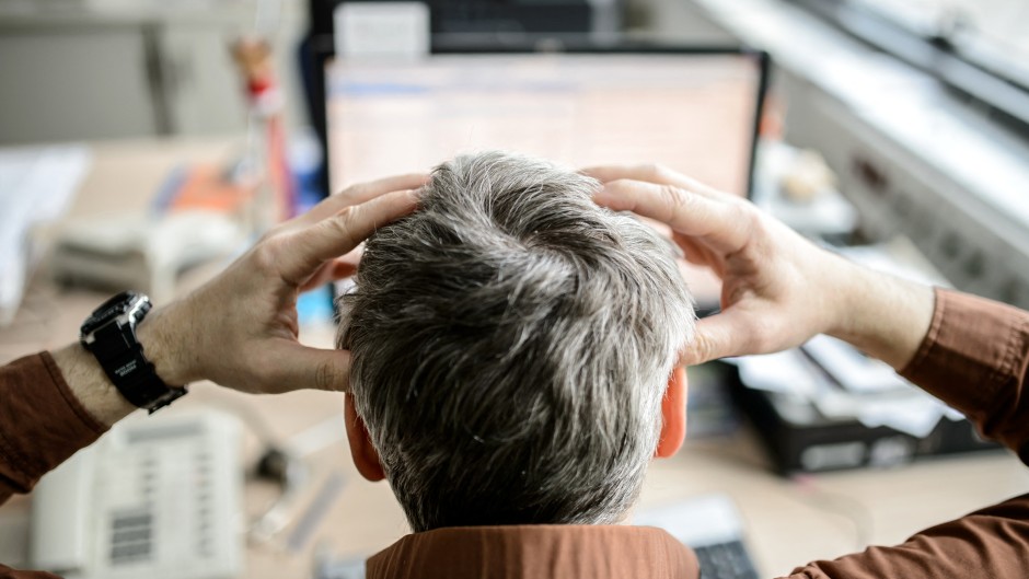 File: A stressed employee. Thomas Eisenhuth/dpa Picture-Alliance via AFP