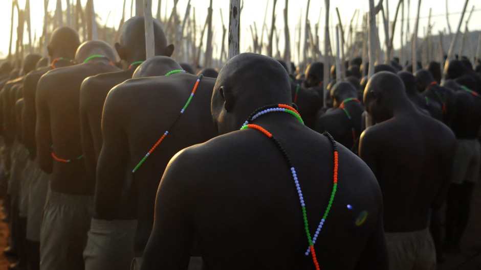 Initiates gather in a group as they return home. AFP/Lucas Ledwaba