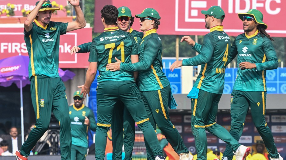 Nandre Burger (2L) celebrates with teammates. AFP/Dibyangshu Sarkar