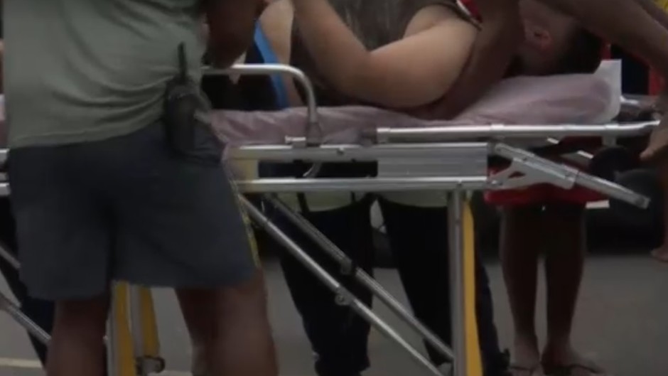 Image of male being rescued from a near-drowning experience at Baggies Beach in Durban.