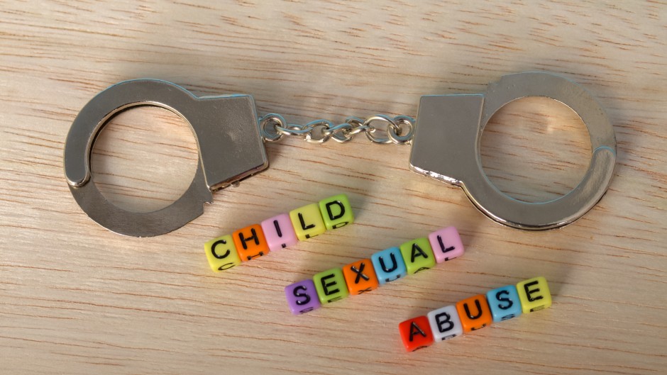 The words 'Child Sexual Abuse' with handcuffs. GettyImages/Abu Hanifah
