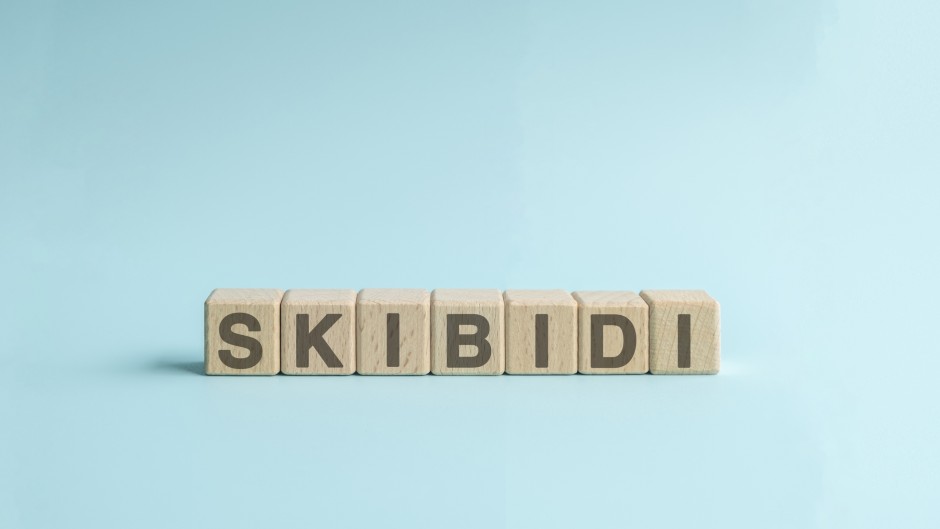 Skibidi text on wooden cube block. GettyImages/Calvin Chan Wai Meng