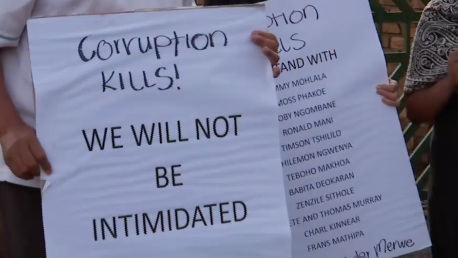 People attending the candlelight vigil.