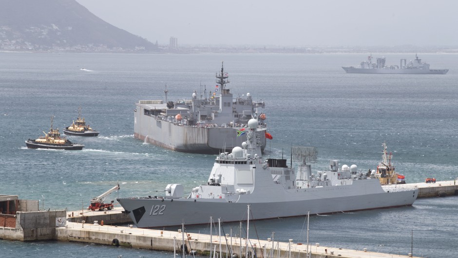 A general view of (L-R) the Chinese guided-missile destroyer Tangshan (Hull 122), the Iranian navy ship, the IRIS Makran 441, Chinese comprehensive supply ship Taihu (Hull 889) in the Simon's Town harbour, near Cape Town, on January 8, 2026.