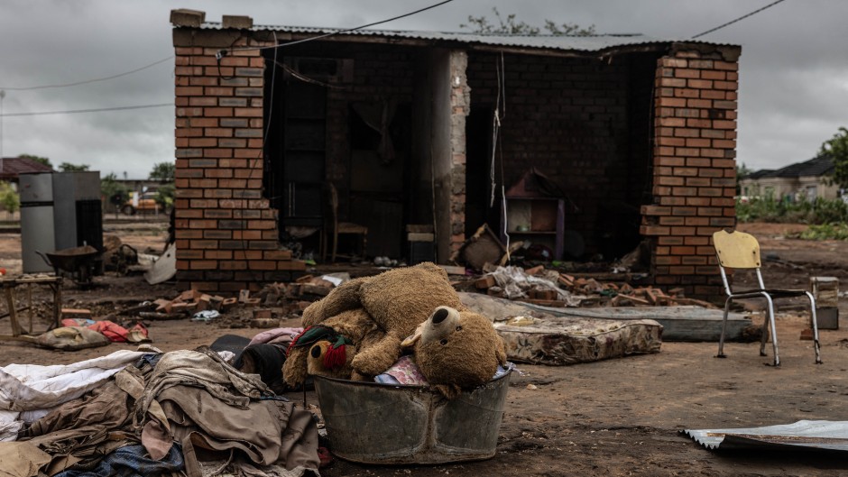 A teddy bear in a tub in front of a damaged house following floods in Mbaula village, 50 km from Giyani. AFP/Paul Botes 