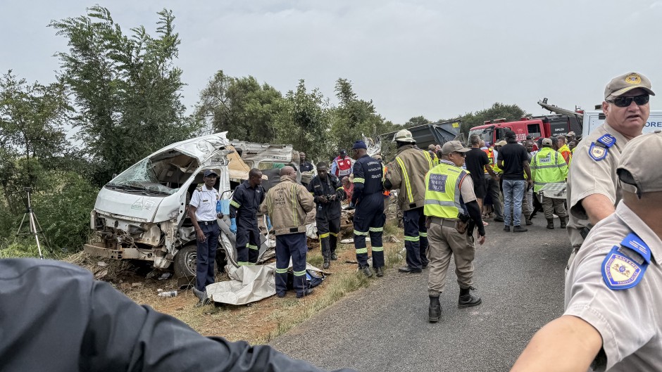 Rescue workers and South African Police Service (SAPS) forensic team members at the scene of the Vaal scholar transport accident. AFP/John Mkhize