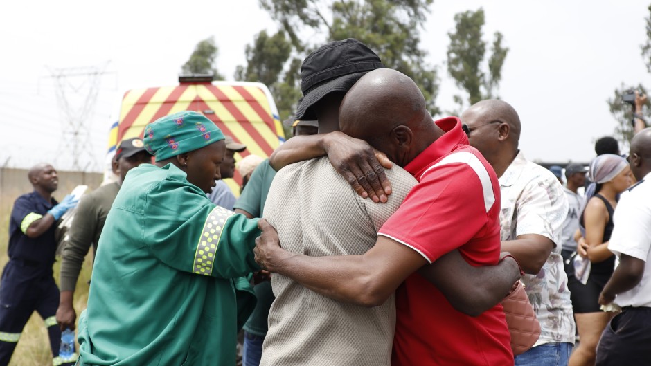 Parents and relatives react at the scene where a scholar transport vehicle crashed in Vanderbijlpark. Gallo Images/Sharon Seretlo