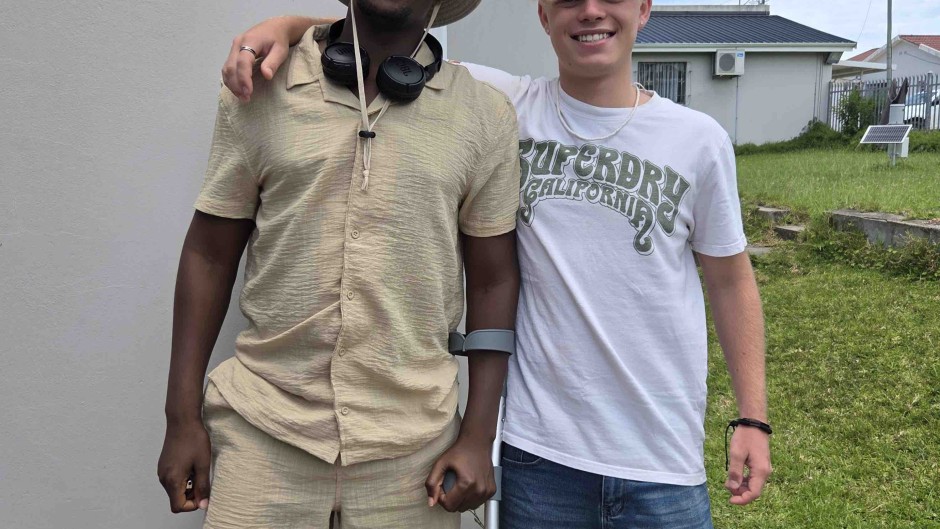James Smith with Singita, the police officer he saved