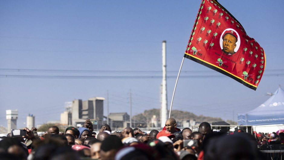 A flag with the image of Economic Freedom Fighters (EFF) leader Julius Malema. AFP/Guillem Sartorio