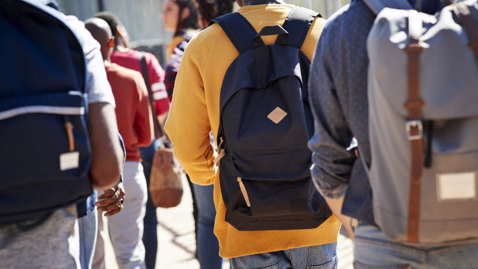 File: Students walking to campus. GettyImages/Klaus Vedfelt