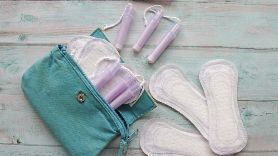 Bag with cotton tampons and sanitary pads. GettyImages/Isabel Pavia