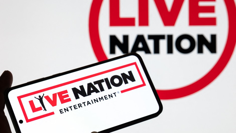 The Live Nation logo is displayed on a mobile phone with the company's branding. Jonathan Raa/NurPhoto via AFP