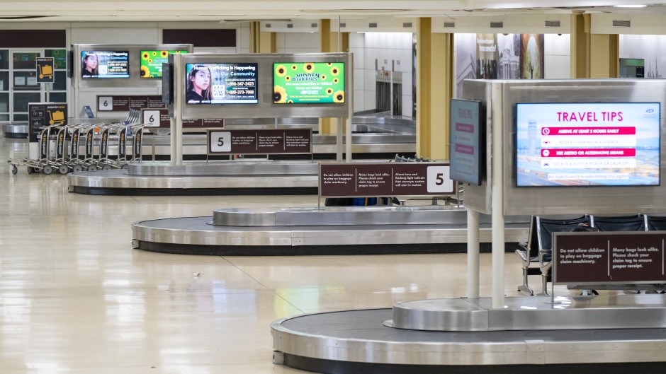 File: An empty baggage claim area at an airport. AFP/Saul Loeb