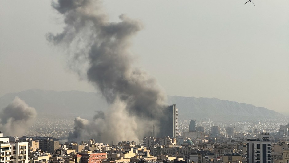 Plumes of smoke rise following reported explosions in Tehran. Mahsa/Middle East Images via AFP