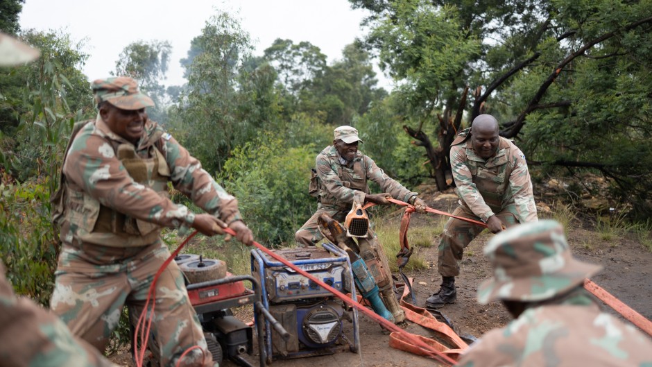 Soldiers recover generators left behind by artisanal miners. AFP/Emmanuel Croset