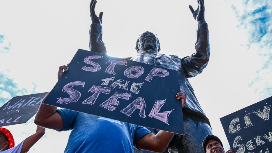 Protesters outside the unveiling of a statue at North Beach Precinct.Gallo Images/Darren Stewart