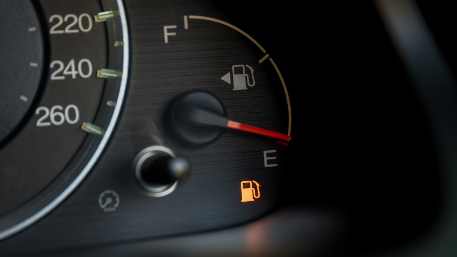 Empty fuel warning light in car dashboard. GettyImages/kckate16