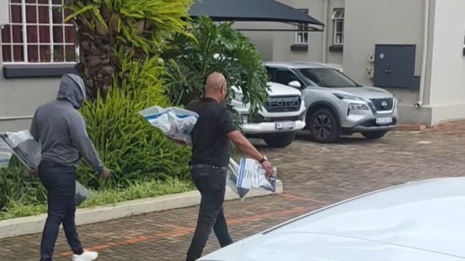 Properties connected to suspects in the murder of Emmanuel Mbense are being searched.