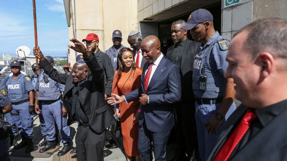 Economic Freedom Fighters (EFF) leader Julius Malema (CR) and his wife Mantwa Malema (CL) leave the KuGompo City Regional court in East London on April 15, 2026 following his sentencing for firing an assault rifle at a rally eight years ago.