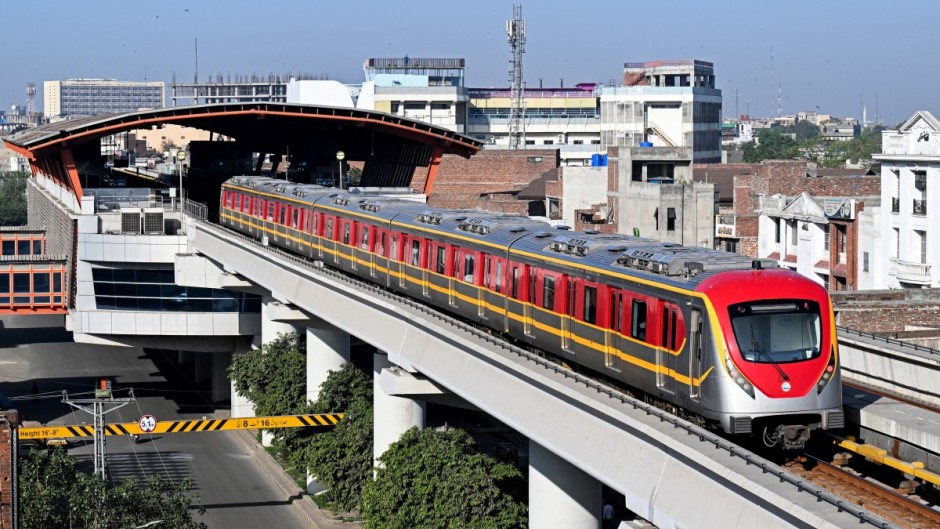 Commuters travel aboard a metro train in Lahore as Pakistan government seeks to promote public transport in response to the global energy crisis triggered by the Middle East war. AFP/Arif Ali