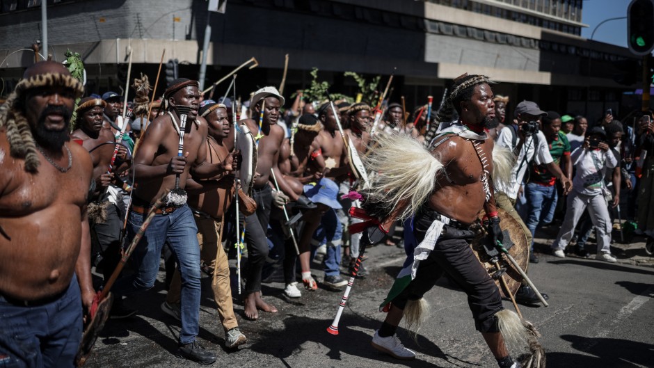 Protestors walk on a street during a protest march against undocumented migrants organised by “March and March” in Johannesburg on April 29, 2026.