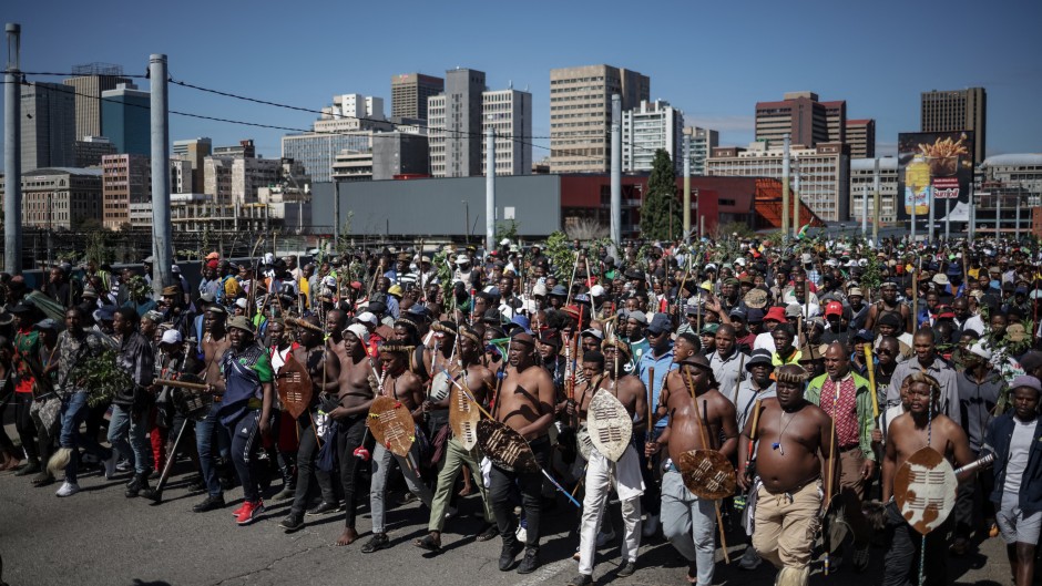 Protestors walk on a street during a protest march against undocumented migrants organised by “March and March” in Johannesburg on April 29, 2026.