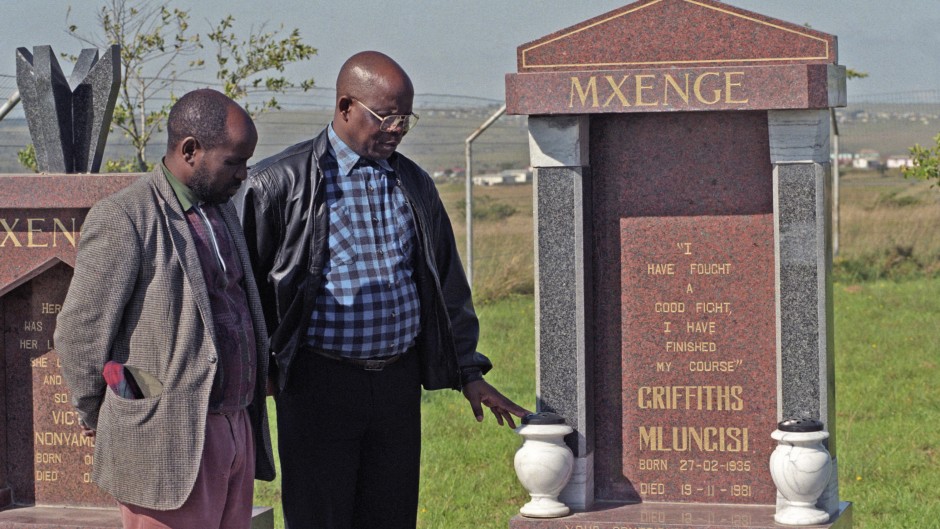 Family members of Griffiths Mxenge visit his, and his wife, Victoria's graves. Gallo Images/Oryx Media Archive
