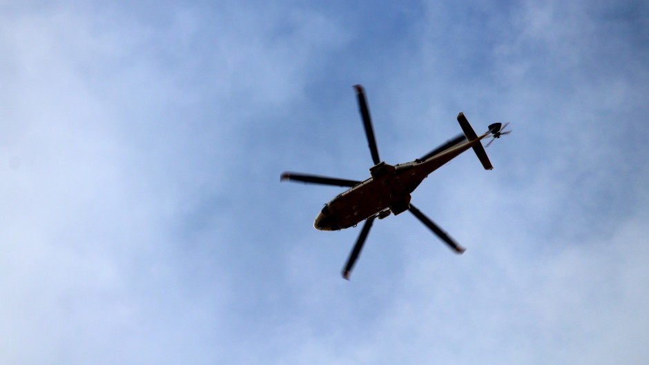 File: A helicopter flying in the sky. GettyImages/Massico Brucci