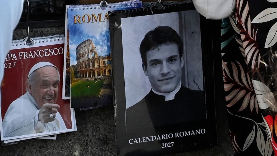 A calendar displaying a picture of Giovanni Galizia dressed as a priest is on sale in a souvenirs shop. AFP/Andreas Solaro