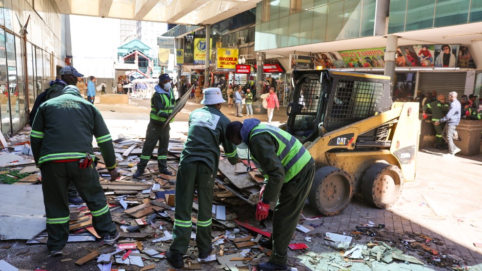 City Of Johannesburg officials work during a by-law enforcement operation to reclaim public spaces, restore law and order and remove illegal structures in the inner city. Gallo Images/Luba Lesolle
