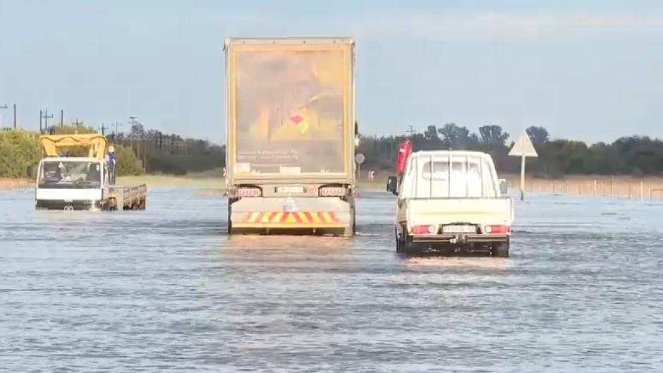 Vehicles stuck in flood waters.