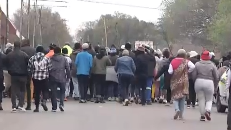 Angry protesters outside the business in Ekurhuleni. 