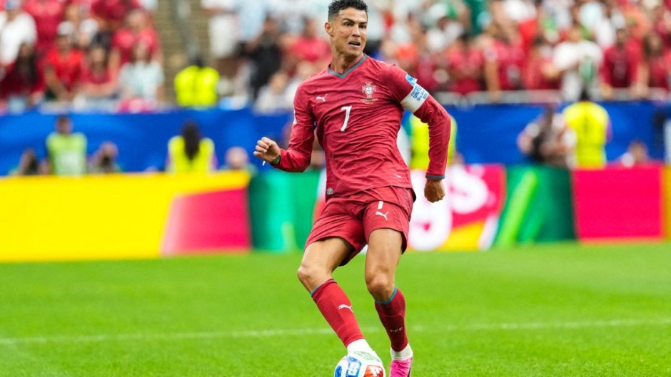 Portugal's #7 forward Cristiano Ronaldo, passes the ball. McGuelber / Odyssey Images via AFP