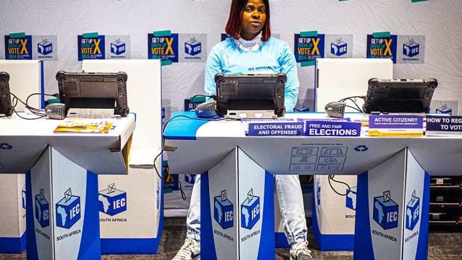 An official sits at a voter registration table at the launch event for the 2026 Municipal elections. Per-Anders Pettersson/Getty Images