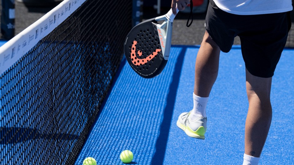A ball and racket used to play padel tennis. AFP/Alain Jocard