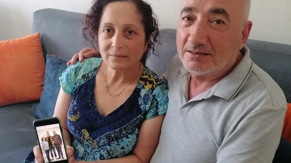 Kerban Kalin and Ali Kalin show a photograph of their son Cadet Officer Alper Kalin who has been serving a life sentence following the last coup in Turkey.
