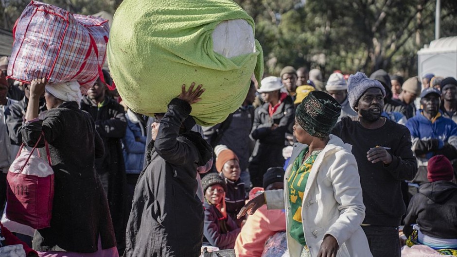 File: A group of Malawian undocumented migrants gather in front of the Malawian Consulate building to prepare for their return home. Ihsaan Haffejee/Anadolu via Getty Images