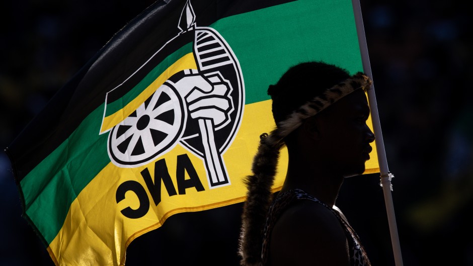 A performer holds an ANC flag while listening to President of the ruling African National Congress (ANC) and South African President, Cyril Ramaphosa speak during the ANC Siyanqoba Rally held at FNB Stadium on May 25, 2024 in Johannesburg, South Africa. South Africa's national and provincial elections will be held on 29 May 2024 to elect a new National Assembly and provincial legislature in each of the nine provinces. (Photo by Chris McGrath/Getty Images)