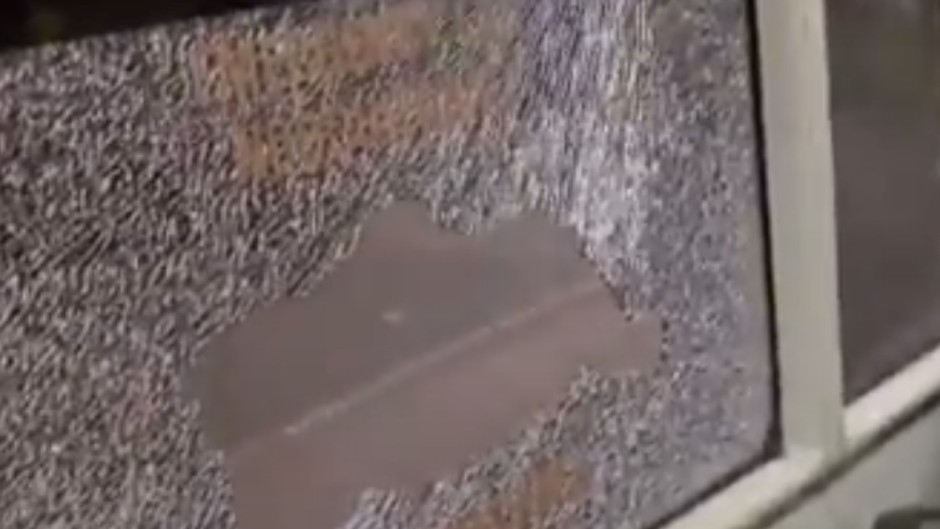 Another video shows a bus with a smashed window. Screenshot