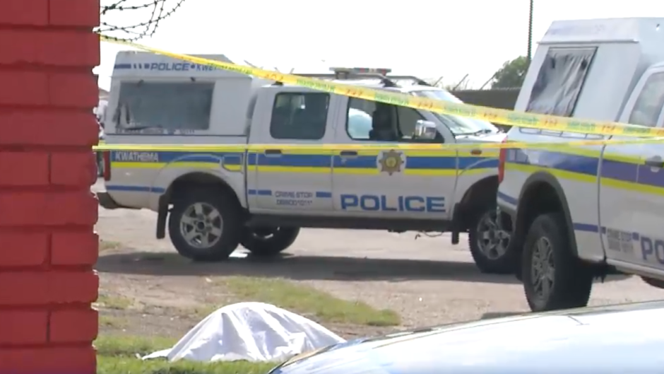 SAPS vehicles at a crime scene
