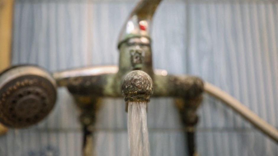 File: Water flows from a tap. Chedly Ben Ibrahim/NurPhoto via AFP