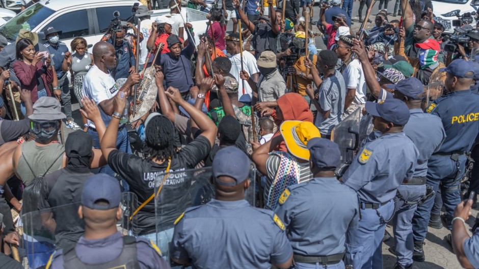 Protestors from the anti-illegal immigration group, March and March Movement chant slogans outside the Department of Home Affairs Refugee Reception Centre during a demonstration at the Che Guevara Road in Durban, on October 8, 2026.