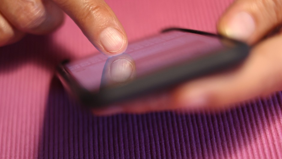 A woman types on an iPhone. Photo: Karl-Josef Hildenbrand/dpa (Photo by Karl-Josef Hildenbrand/picture alliance via Getty Images)