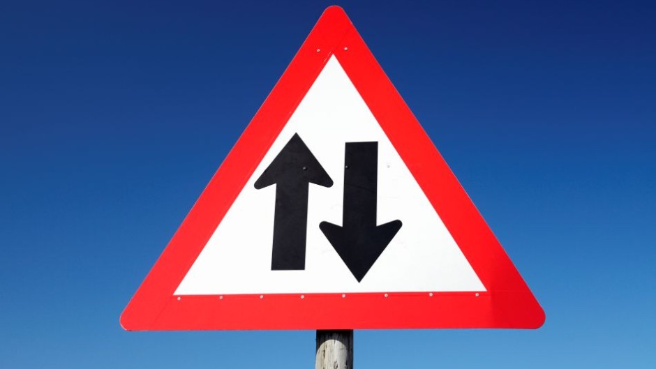 File: A road sign indicating a two-way road. Gallo/Neil Overy
