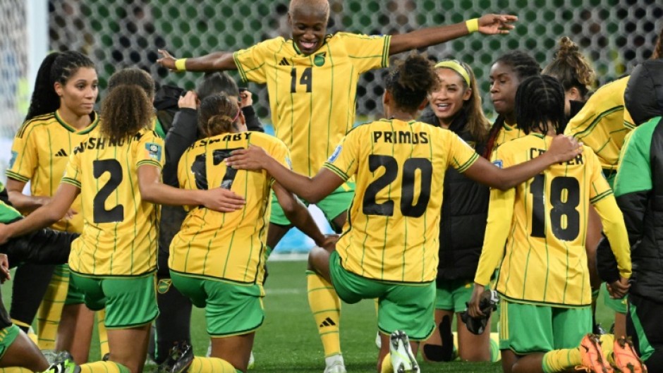 Jamaica's players celebrate qualifying for the next round of the Women's World Cup after knocking Brazil out with a 0-0 draw in Melbourne
