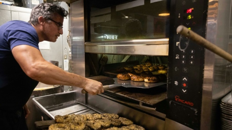 Andrew Martinez, seen here, and his wife Ashley Dikos have struggled to keep up with demand since opening Bo's Bagels in a part of Harlem that had been a bagel desert in a city long known for the deliciously doughy baked circles