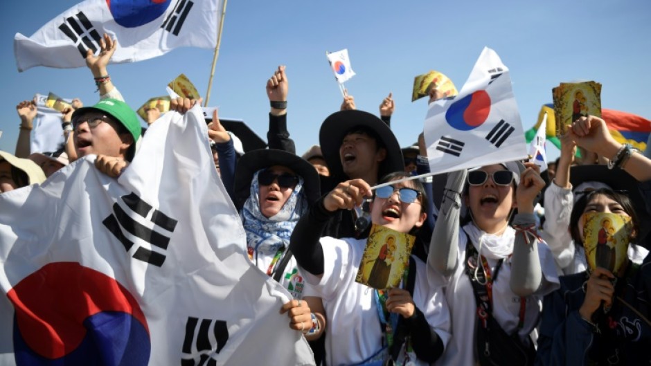 S. Korean pilgrims celebrate after the pope says Seoul will host the next World Youth Day